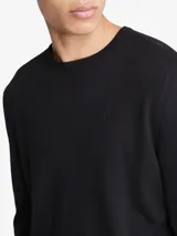Sweater negro de punto de lana merino con poliéster, cuello redondo y logo CK bordado en el pecho.