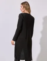 Conjunto de cardigan largo y pantalón palazzo plisado color celeste.