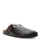 Zuecos de estilo casual color negro, con diseño cerrado en la parte delantera, hebilla metálica lateral y suela de corcho con base de goma.