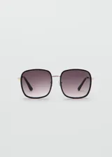 Lentes de sol con montura cuadrada combinada de policarbonato negro y detalles de cobre, con cristales degradados.