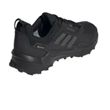 Championes de senderismo Adidas Terrex AX4 GORE-TEX, color negro. Cuentan con membrana GORE-TEX impermeable y suela de caucho Continental para mayor agarre.