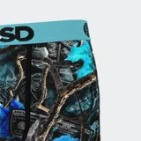Calzoncillos bóxer estampados con billetes de 100 dólares, hojas de arce y ramas de árbol en tonos azules, negros y grises. Cintura elástica celeste con logo de la marca en negro.