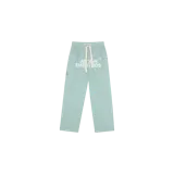 Pantalón de pijama a rayas color verde menta con cordón ajustable en la cintura y el texto "JE T'AIME EME STUDIOS" estampado en el frente.