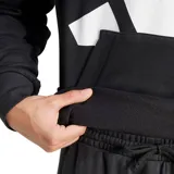 Canguro Adidas de hombre, color negro con el logo de la marca en blanco estampado en el frente. Cuenta con capucha con cordones ajustables, bolsillo tipo canguro y puños elásticos.