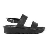 Sandalias bajas negras de Korium con doble tira ancha y hebilla lateral.