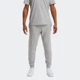 Pantalón deportivo para hombre, color gris melange, confeccionado en tejido polar de algodón y poliéster reciclado. Presenta puños elásticos en los tobillos y un pequeño logotipo Reebok bordado.
