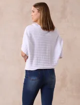 Buzo azul de tejido acanalado marca Ninety, con mangas cortas japonesas.