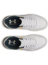 Championes Under Armour modelo UA Flex, color blanco con detalles en verde oscuro, amarillo y suela de goma marrón. Parte superior de cuero premium con entresuela de EVA.