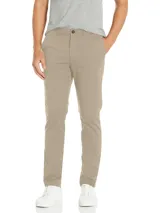 Pantalón de vestir de corte slim, color beige, confeccionado en mezcla de algodón elástico. Presenta cierre de botón y cremallera.