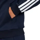 Campera deportiva Adidas House Of Tiro Nations Pack, color azul marino con detalles en celeste y blanco en las mangas, y logo dorado en el pecho.