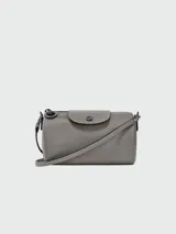 Bandolera Longchamp modelo Le Pliage Xtra XS, color gris.