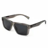 Lentes de sol polarizados con armazón de acetato gris translúcido y diseño cuadrado, con cristales oscuros.