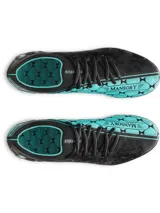 Championes de fútbol Under Armour modelo Magnetico Elite, en colaboración con Mansory. Presentan un diseño en color negro con detalles en turquesa, parte superior UA Clone para un ajuste personalizado, impresión 3D para mayor control y suela con tacos mixtos para superficies naturales firmes.