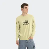 Buzo de cuello redondo marca Reef, color verde claro con efecto lavado. Presenta un estampado gráfico central con el logo de la marca y detalles en tonos oscuros.