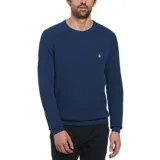 Sweater de punto con textura de panal, color azul, con cuello redondo y mangas largas con puños acanalados. Presenta el logo de la marca bordado en el pecho.