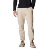 Pantalón de jogging color beige, confeccionado en mezcla de algodón, con cintura elástica ajustable mediante cordón, bolsillos laterales y bolsillo trasero. Presenta puños acanalados en los tobillos y un pequeño parche con el logo de la marca en la parte frontal.