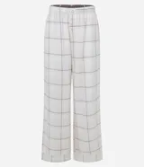 Pantalón de pijama Lov de corte holgado, confeccionado en franela con estampado de cuadros. Presenta cintura elástica y detalle de botones decorativos en la parte frontal.