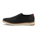Zapato casual de hombre color negro, sin cordones, con elásticos laterales y suela gruesa.