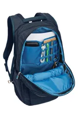 Mochila Thule Construct de 28 litros, color azul con textura lineal. Cuenta con compartimento acolchado para laptop de hasta 15.6 pulgadas y tablet de hasta 10.5 pulgadas, múltiples bolsillos organizadores internos, bolsillo frontal vertical, bolsillo lateral con cierre y bolsillo expandible para botella. Incluye panel trasero acolchado con malla respirable, correas de compresión laterales y correa pasante para equipaje.