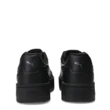 Championes urbanos Puma modelo Court Lally Skye, de diseño monocromático negro con plataforma elevada y cierre de cordones.