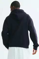 Campera con capucha H&M de felpa azul marino con cierre frontal y bolsillos tipo canguro.