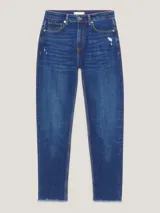 Pantalón jean azul de corte cónico, con talle alto y efecto desteñido.