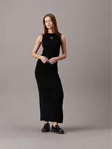 Falda larga negra de lyocell de canalé, con cintura elástica, abertura lateral y logo de Calvin Klein en la cintura.