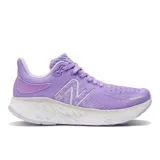 Championes de running New Balance Fresh Foam X 1080v12, color lila con detalles en blanco.