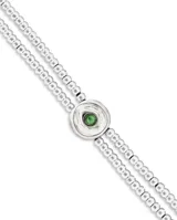 Pulsera doble de aleación de metales bañada en plata, con cuentas de bolas y detalle de ojo con cristal verde.
