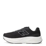 Championes de running New Balance modelo Kaiha, color negro con entresuela blanca y detalles en tono rosado pálido. Presentan un diseño de malla transpirable con el logo N característico en el lateral.