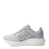 Championes New Balance modelo 460, color gris con detalles en verde claro. Presentan un exterior de malla transpirable con refuerzos sintéticos, cierre con cordones y entresuela blanca amortiguada.