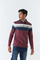 Remera polo de manga larga con diseño a rayas horizontales en tonos negro, gris y blanco. Logo de la marca Mistral bordado en el pecho.