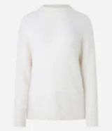 Suéter de punto color crema con cuello redondo y mangas largas ajustadas. Modelo slim alargado con efecto de pelitos.