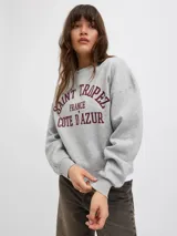 Buzo marrón de cuello redondo con estampado frontal en color blanco que dice "Palm Springs 1998 Los Angeles". De corte relajado y mangas largas con puños elásticos.
