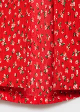 Vestido midi de corte recto con estampado floral, cuello en pico y mangas cortas. Presenta una abertura lateral en la falda y cierre de cremallera lateral.