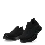 Championes urbanos sin cordones, confeccionados en tejido de punto elástico color negro, con suela de goma robusta y diseño ergonómico.