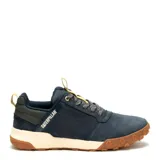 Zapatos Caterpillar modelo Hex Ready Lo, color azul marino, estilo casual/outdoor de caña baja. Presentan capellada de nobuk o material similar, cordones grises jaspeados, tirador trasero en color beige claro y suela bicolor con entresuela color crema y suela exterior de goma marrón con diseño de hexágonos.