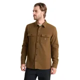Camisa de manga larga Roark modelo Nordsman, confeccionada en tejido de mezcla de lana. Presenta cuello clásico, cierre frontal con botones, dos bolsillos frontales con solapa y botones, y paneles reforzados en los codos.