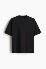 Remera de corte oversized en punto de algodón, con cuello redondo acanalado, hombros caídos y bajo recto.