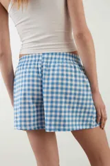 Short de pijama de algodón gris claro melange, con cintura elástica y diseño cómodo.