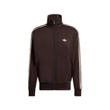 Campera deportiva Adidas modelo Firebird de color marrón oscuro, con cuello alto, cierre frontal completo y bolsillos laterales con cierre. Presenta las clásicas tres tiras de la marca en color claro a lo largo de las mangas y el logo del trifolio bordado en el pecho.