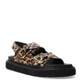 Sandalias planas de mujer Miss Carol modelo Milan, con tiras de cuero sintético con estampa animal print de leopardo, hebillas metálicas doradas y suela chunky negra.