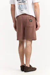 Short de algodón color beige, de diseño liso con cintura elastizada y cordón ajustable.