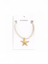 Gargantilla con cordón trenzado color blanco y dije de estrella de mar dorada.