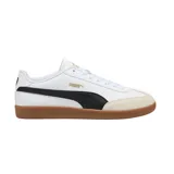 Championes Puma 9T blancos con detalles en negro y suela de goma color caramelo.