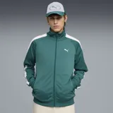 Campera deportiva Puma con cierre frontal, cuello alto y puños acanalados. Diseño en color verde esmeralda con franjas blancas laterales en las mangas y logo de la marca estampado en el pecho.