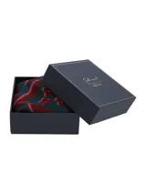 Pañuelo de seda estampado en tonos fucsia, bordó y verde oscuro, con diseño abstracto.