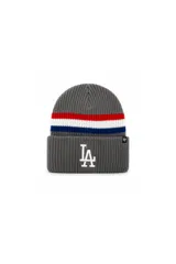 Gorro tejido tipo beanie con puño, color gris, con franjas horizontales en rojo, blanco y azul. Presenta el logo de los Los Angeles Dodgers bordado en relieve en el frente y etiqueta lateral de la marca 47.