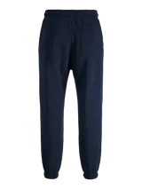 Pantalón de jogging color azul marino, con corte regular y tejido de punto con interior afelpado. Presenta cintura elástica con cordón ajustable y puños acanalados en los tobillos. Incluye un pequeño logo estampado en blanco en la parte superior de la pierna.