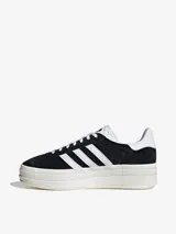 Zapatillas Adidas Gazelle Bold para mujer, color negro con las tres tiras blancas y plataforma de triple capa color crema.